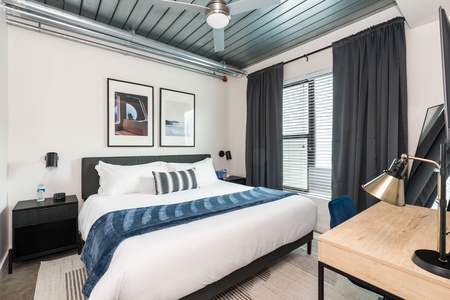 Rest in style on a memory foam bed in this cozy bedroom.