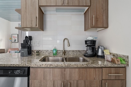Prepare your favorite dishes in this well-equipped kitchen with modern amenities.