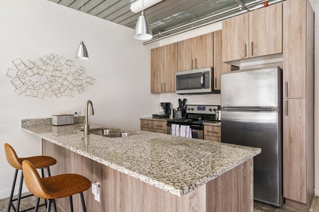 Prepare your favorite dishes in this well-equipped kitchen with modern amenities.