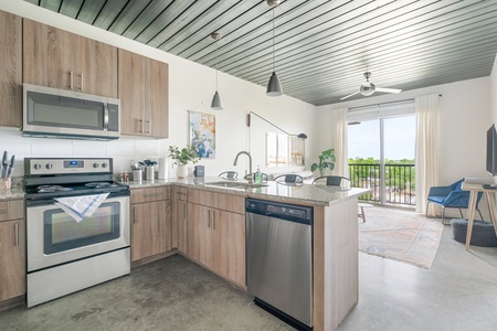 Whip up culinary delights in this modern kitchen with all the essentials.