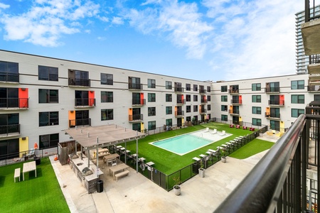 Enjoy courtyard views of the pool sitting outside on the Juliette balcony