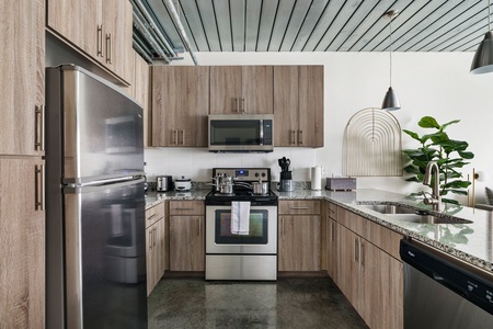 Whip up tasty treats in this modern kitchen with all the essentials.