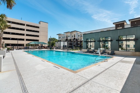 The community features a pool with communal grills and a kids' play area
