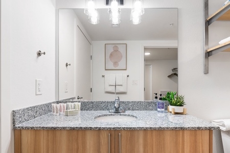Rejuvenate in the sleek bathroom with complimentary toiletries.