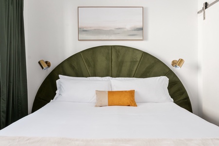 Experience a tranquil rest on a memory foam mattress in this cozy bedroom equipped with a 40' smart TV.