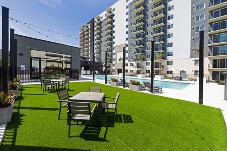 The community features a pool with communal grills and a kids' play area
