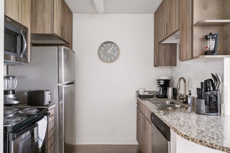 Whip up culinary delights in this modern kitchen with all the essentials.