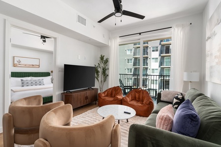Get comfortable and indulge in the smart TV in this well-designed, cozy modern living area.
