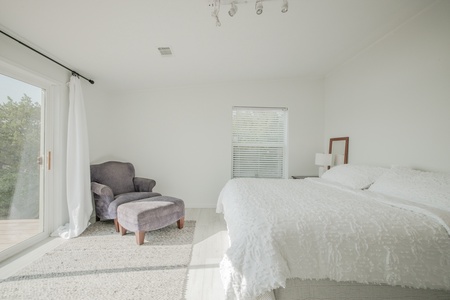 The second primary bedroom with gorgeous views and a king-size bed