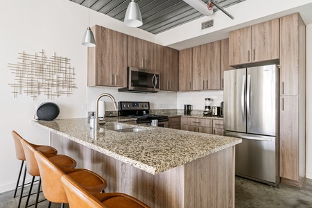 Prepare delicious meals in this modern kitchen with all the essentials.