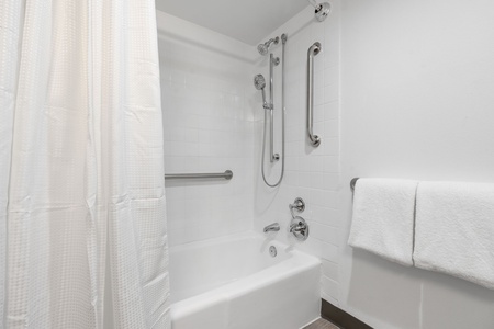 Freshen up in the bathroom with complimentary toiletries and a high pressure shower.