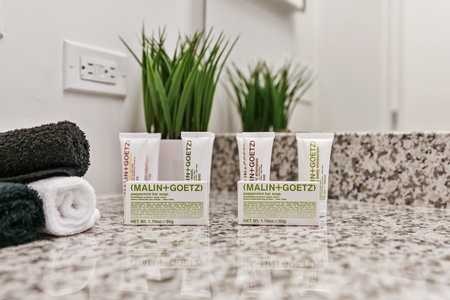 Spoil yourself with complimentary toiletries by Malin + Goetz in the bathroom.