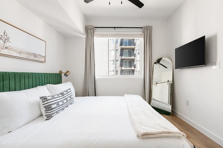 Unwind and recharge in this snug bedroom featuring a supportive memory foam mattress and a smart TV.