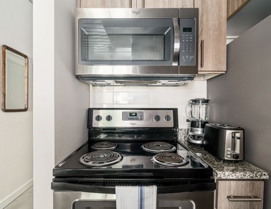 Whip up tasty treats in this modern kitchen with all the essentials.