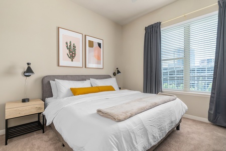 Rest in style on a memory foam bed in this cozy bedroom.