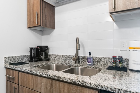 Craft tasty dishes in this contemporary kitchen with all the necessary amenities.