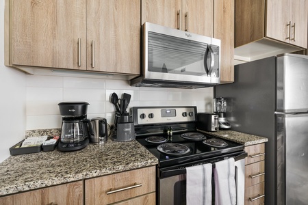 Whip up tasty treats in this modern kitchen with all the essentials.