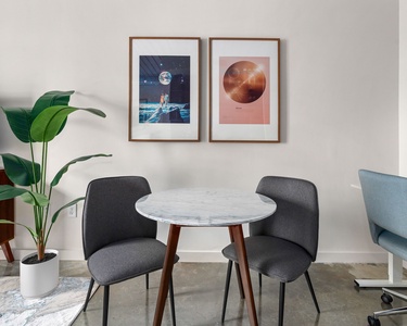 This listing features both a dining table and an adjustable-height desk