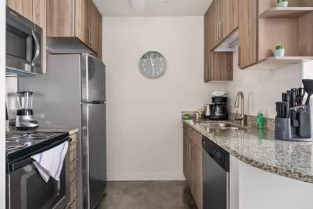 Whip up tasty treats in this modern kitchen with all the essentials.