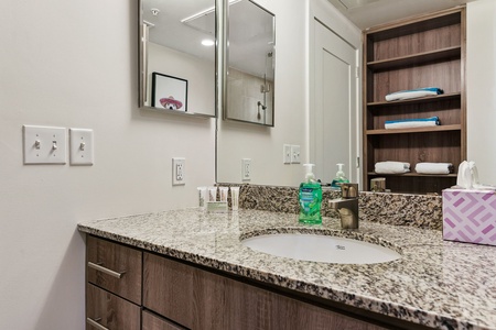 Freshen up in the sleek bathroom with complimentary toiletries.