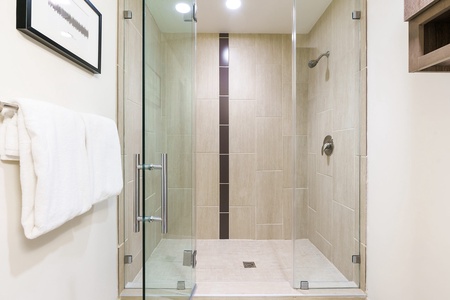 Enjoy a fresh start in the modern walk-in shower with stylish fixtures.