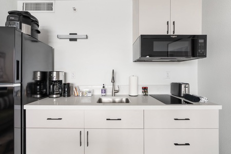 Design meets function in the equipped kitchenette.