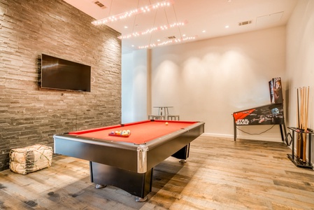 The residents' lounge includes a pool table, darts board, table tennis, and classic arcade games
