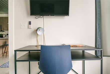 Make progress in the dedicated desk area with plenty of natural light.