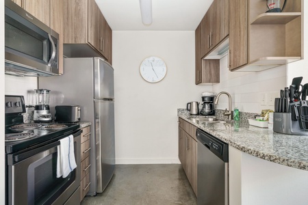 Prepare delicious meals in this modern kitchen with all the essentials.