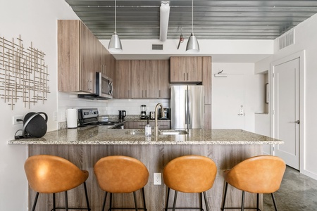 Prepare delicious meals in this modern kitchen with all the essentials.