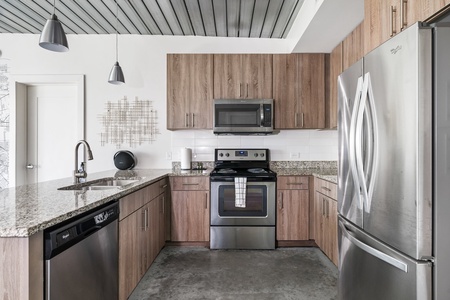 Craft tasty dishes in this contemporary kitchen with all the necessary amenities.