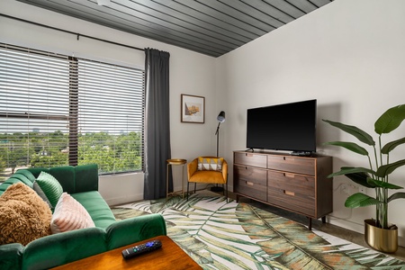 Snuggle in and enjoy the smart TV experience in this chic and comfortable modern living area.