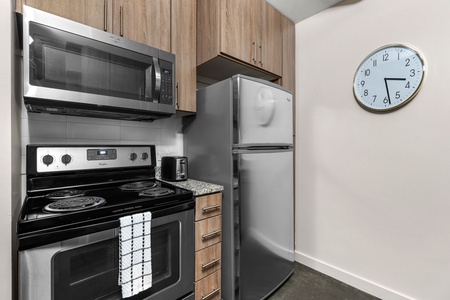 Craft tasty dishes in this contemporary kitchen with all the necessary amenities.