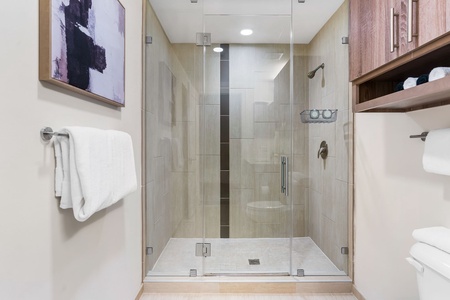 Freshen up in the sleek bathroom with complimentary toiletries.