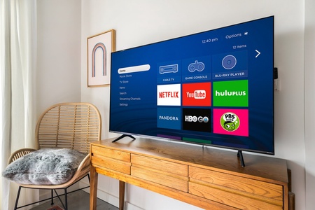 Binge-watch your preferred shows with the smart TV and sound system for streaming.