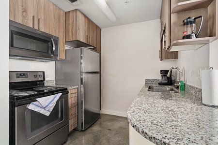 Craft tasty dishes in this contemporary kitchen with all the necessary amenities.