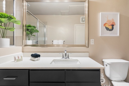 Freshen up in the sleek bathroom with complimentary toiletries.