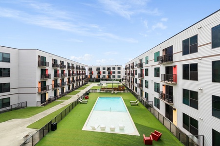 Take in stunning courtyard and pool views from your private Juliette balcony.