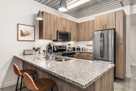 Create magic in this contemporary kitchen with all the necessary amenities.