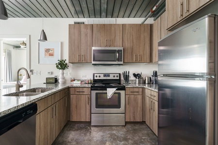 Whip up tasty treats in this modern kitchen with all the essentials.