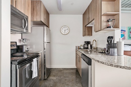 Prepare delicious meals in this modern kitchen with all the essentials.