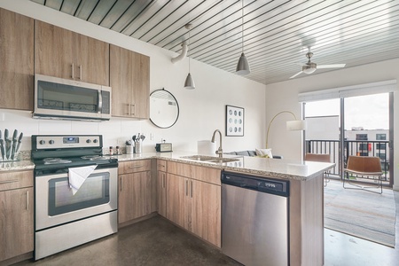 Craft tasty dishes in this contemporary kitchen with all the necessary amenities.