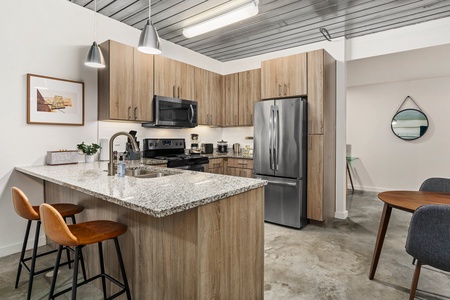 Craft tasty dishes in this contemporary kitchen with all the necessary amenities.