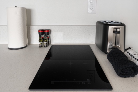 Cook up a meal on the induction cooktop, with cookware included for your use.