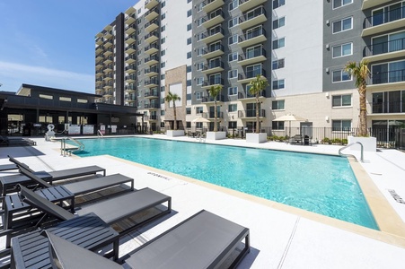 The community features a pool with communal grills and a kids' play area