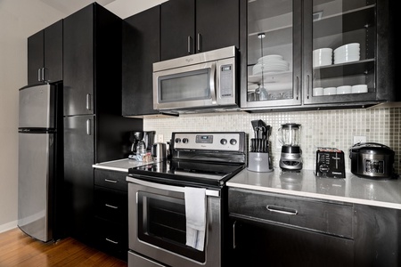 Create delicious meals in this well-equipped kitchen with modern amenities.