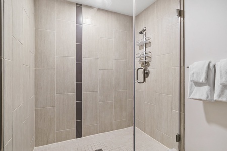 Renew in the updated walk-in shower with modern fixtures.