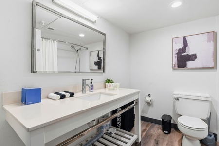 Freshen up in the bathroom with complimentary toiletries and a high pressure shower.