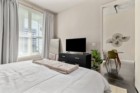 Sink into comfort on a memory foam bed in this inviting bedroom.