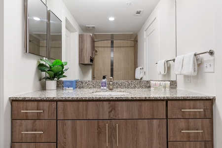 Freshen up in the sleek bathroom with complimentary toiletries.